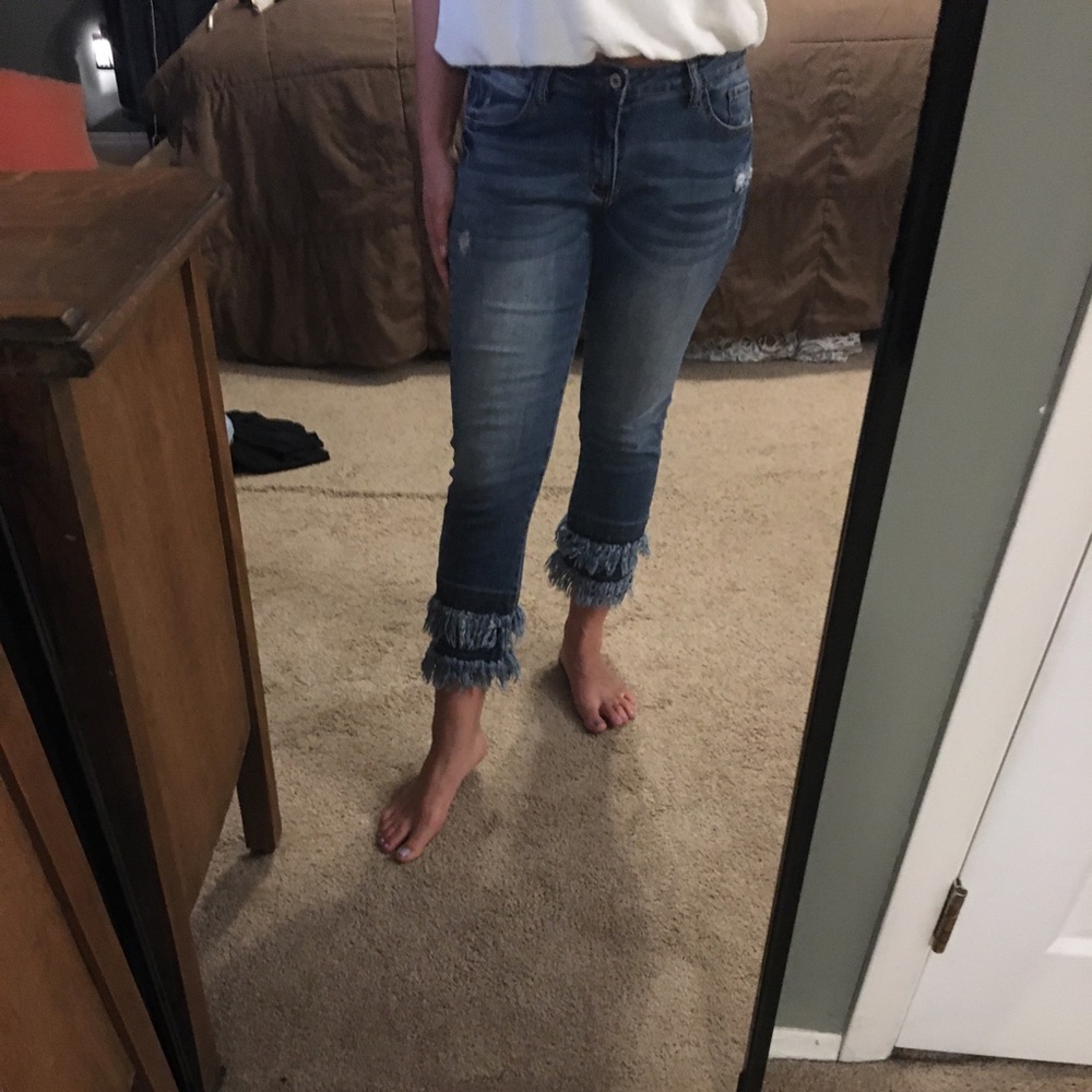 Capri or ankle length jeans shredded bottom